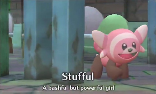 Stufful from Pokémon smiling with text that says a bashful but powerful girl