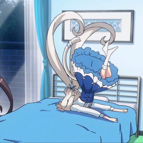 Anime girl in a dress falling face first onto her bed